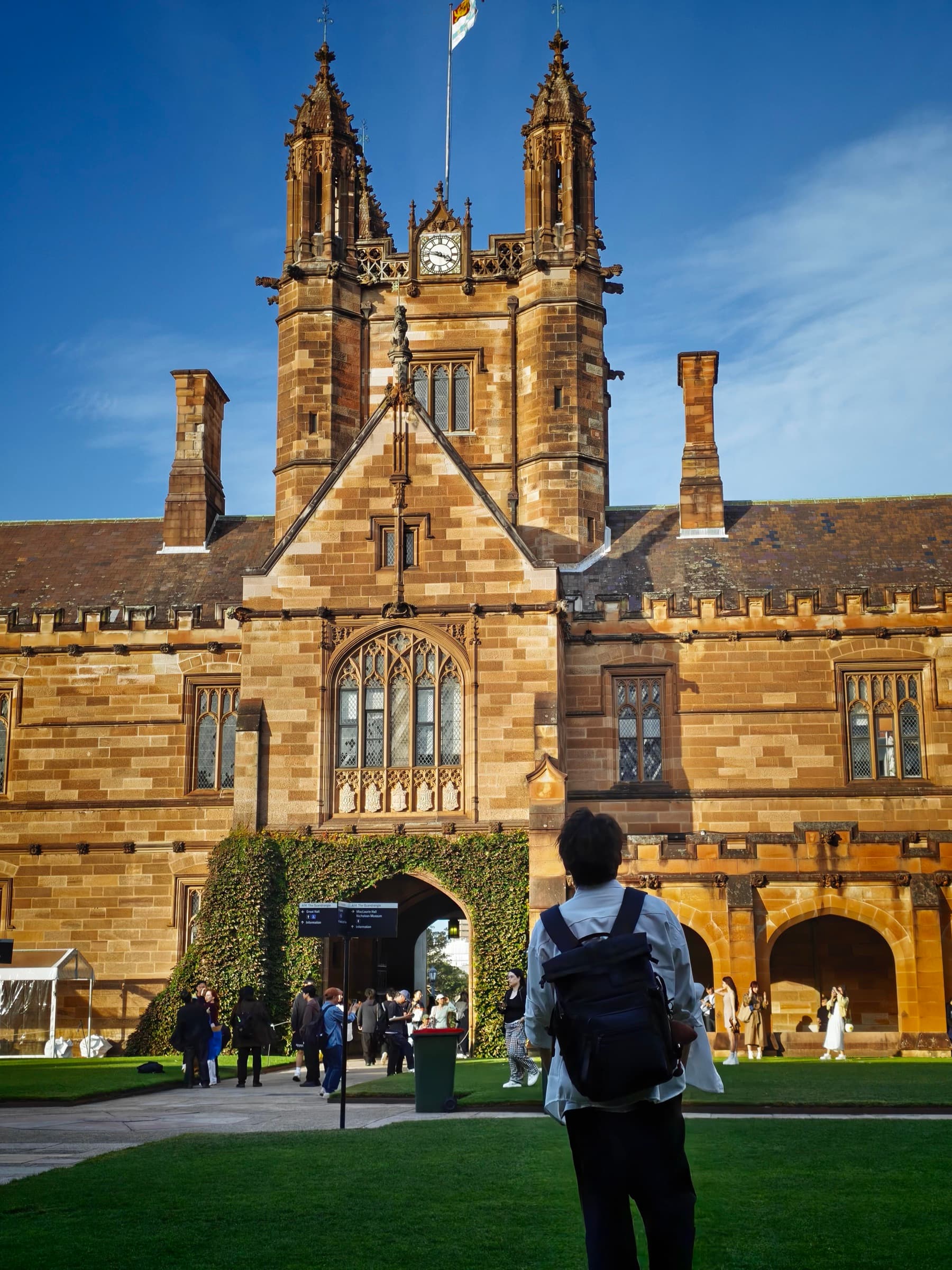 YueYong standing in front of the University of Sydney Quadrangle